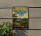 A vintage-style sign for Golden Hill State Park, featuring a scenic landscape with a river, mountains, and a pine tree.