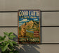 A vintage-style metal sign for Good Earth State Park in South Dakota, featuring a mountain landscape and a prairie dog.