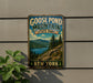 A vintage-style sign for Goose Pond Mountain State Park in New York, featuring a scenic mountain landscape with pine trees and a lake.