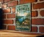 A vintage-style sign for Governor Knowles State Forest in Wisconsin, featuring a scenic landscape with pine trees, a lake, and mountains.