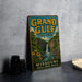 A vintage-style metal sign for Grand Gulf State Park, featuring a waterfall and a scenic landscape, is displayed on a gray concrete surface.