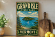A vintage-style sign for Grand Isle State Park in Vermont, featuring a scenic image of the island and its surrounding waters.