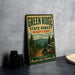 A vintage-style metal sign for the Green Ridge State Forest in Maryland, featuring a scenic mountain landscape and the text "Green Ridge State Forest Maryland" prominently displayed.