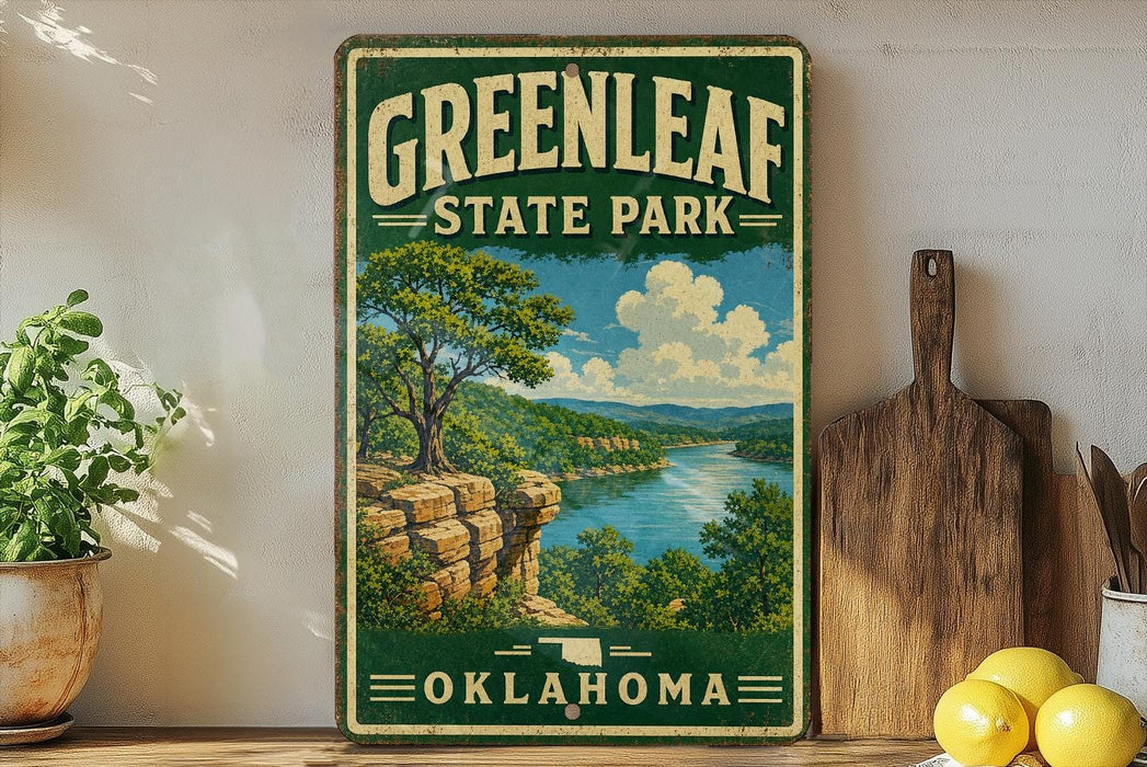A vintage-style sign for Greenleaf State Park in Oklahoma, featuring a scenic landscape with a river, cliffs, and trees.