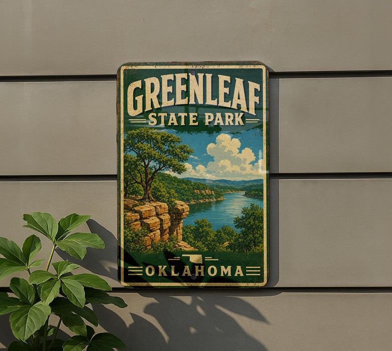 A vintage-style sign for Greenleaf State Park in Oklahoma, featuring a scenic landscape with a river, cliffs, and trees.