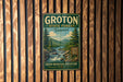 A vintage metal sign for Groton State Forest in Vermont, featuring a scenic illustration of a forest and a river.