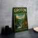 A vintage-style metal sign for Groton State Forest in Vermont, featuring a scenic illustration of a forest and a river.