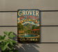 A vintage-style sign for Grover Hot Springs State Park in California, featuring a scenic image of the hot springs and mountains.