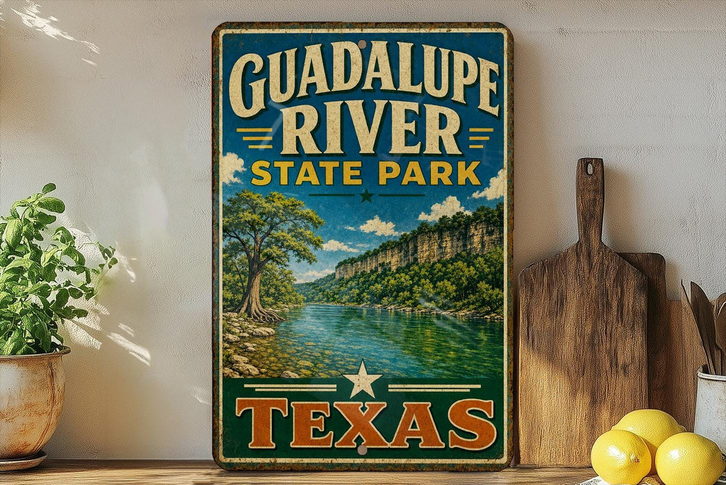 A vintage-style sign for Guadalupe River State Park in Texas, featuring a scenic landscape with a river, mountains, and trees.