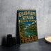 A vintage-style metal sign for Guadalupe River State Park in Texas, featuring a scenic landscape with a river, mountains, and trees.