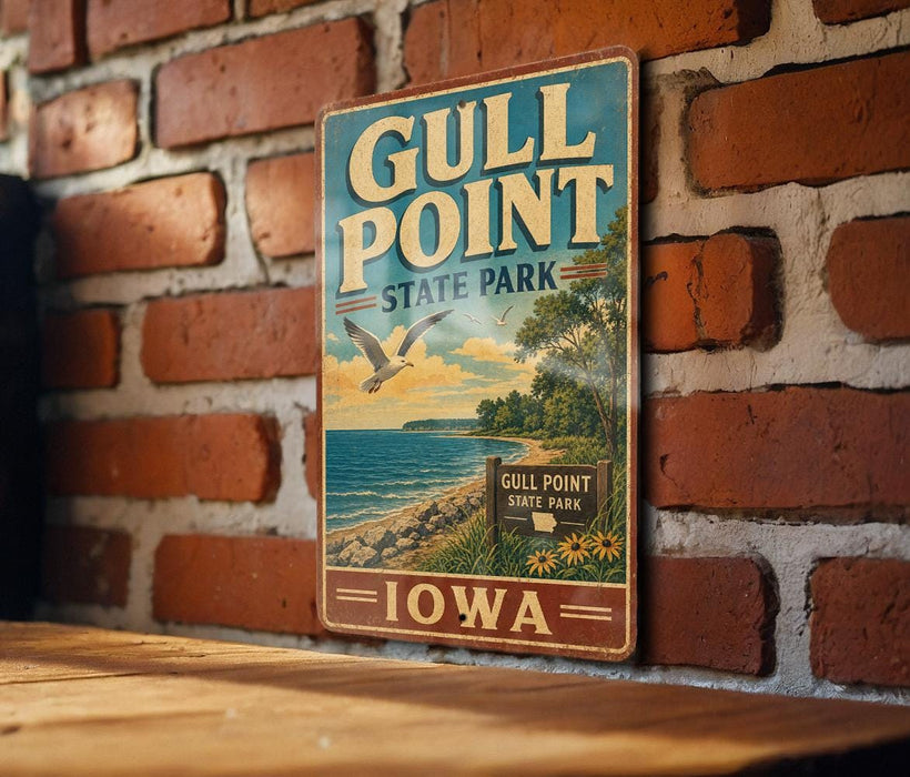A vintage metal sign for Gull Point State Park in Iowa, featuring a scenic illustration of the park's landscape with a bird flying over the water.