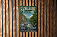 A vintage metal sign for Hackleton Pond State Park in New Jersey, featuring a scenic illustration of a river and forest landscape.