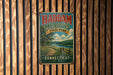 A vintage metal sign for Haddam Meadows State Park in Connecticut, featuring a scenic landscape with a river and a wooden fence.