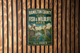 A metal sign for the Hamilton County State Fish & Wildlife Area in Illinois, featuring an illustration of ducks and a bird in a natural setting.