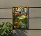A vintage-style metal sign for Harpeth River State Park in Tennessee, featuring a scenic landscape with a river, trees, and mountains.