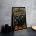 A vintage-style metal sign for Harriet Tubman Underground Railroad State Park in Maryland, featuring an illustration of a woman holding a lantern and a wagon.