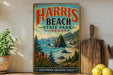 A vintage-style sign for Harris Beach State Park in Oregon, featuring a scenic coastal landscape with mountains, pine trees, and a rocky coastline.