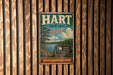 A vintage metal sign for Hart State Park in Georgia, featuring a scenic landscape with a lake and pine trees.