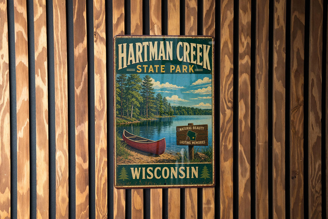 A vintage-style sign for Hartman Creek State Park in Wisconsin, featuring a scenic image of a lake, canoe, and forest.