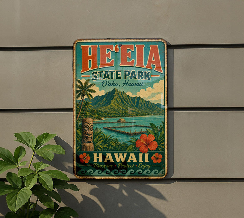 A vintage-style metal sign for He'eia State Park in Oahu, Hawaii, featuring a tropical landscape with palm trees, mountains, and a tiki statue.