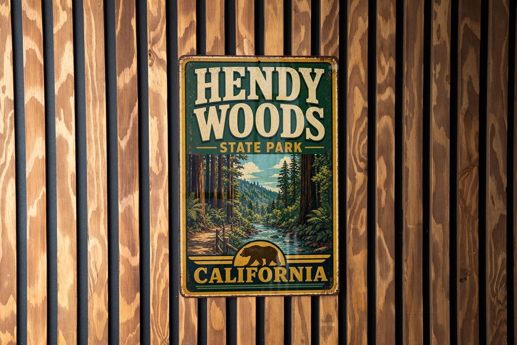 A vintage metal sign for Hendy Woods State Park in California, featuring a scenic illustration of the park's natural surroundings.