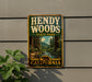 A vintage-style metal sign for HENDY WOODS State Park in California, featuring a scenic image of a forest and a river.