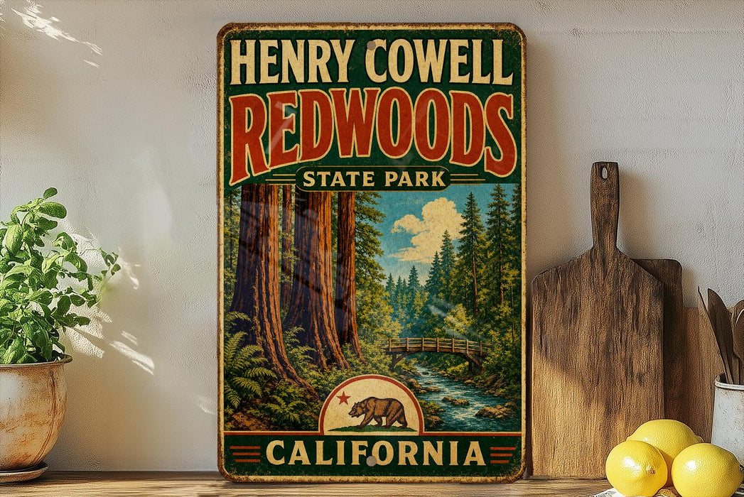A vintage-style metal sign for Henry Cowell Redwoods State Park in California, featuring a scenic illustration of the park's landscape with towering redwood trees, a stream, and a bridge.
