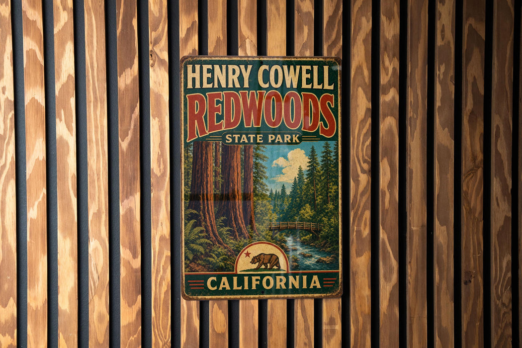 A vintage metal sign for Henry Cowell Redwoods State Park in California, featuring a scenic illustration of the park's iconic redwood trees and a bear.