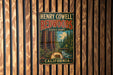 A vintage metal sign for Henry Cowell Redwoods State Park in California, featuring a scenic illustration of the park's iconic redwood trees and a bear.