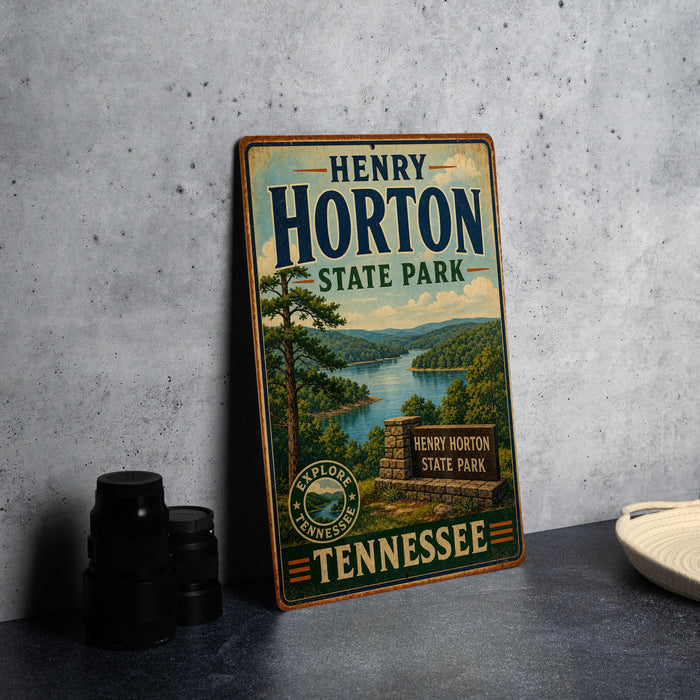 A vintage-style sign for Henry Horton State Park in Tennessee, featuring a scenic landscape with a lake and forest.
