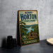 A vintage-style sign for Henry Horton State Park in Tennessee, featuring a scenic landscape with a lake and forest.