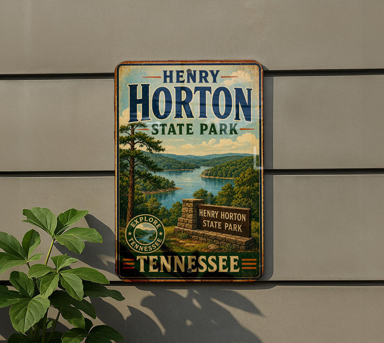 A vintage-style metal sign for Henry Horton State Park in Tennessee, featuring a scenic landscape with a lake and mountains.