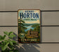 A vintage-style metal sign for Henry Horton State Park in Tennessee, featuring a scenic landscape with a lake and mountains.