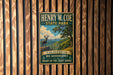 A vintage-style metal sign for Henry W. Coe State Park, featuring a scenic illustration of a deer in a mountainous landscape.