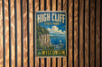 A vintage-style metal sign for High Cliff State Park in Wisconsin, featuring a scenic illustration of the park's cliffs and water.