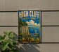 A vintage-style metal sign for High Cliff State Park in Wisconsin, featuring a scenic cliffside landscape with a lake and sailboats.