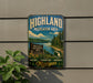 A vintage metal sign for the Highland Recreation Area in Michigan, featuring a scenic landscape with a lake, mountains, and pine trees.