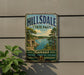 A vintage-style metal sign for Hillsdale State Park in Kansas, featuring a scenic landscape with a lake and mountains.