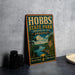 A vintage-style metal sign for Hobbs State Park, featuring a scenic landscape with a river and mountains, is displayed on a gray concrete surface.