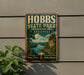 A vintage-style metal sign for Hobbs State Park, featuring a scenic landscape with a lake and mountains, is displayed on a wall.