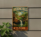 A vintage-style sign for Hocking Hills State Park in Ohio, featuring a scenic image of a waterfall and a bridge.