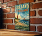 A vintage-style metal sign for Holland State Park in Michigan, featuring a lighthouse and beach scene, is displayed on a brick wall.