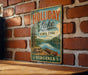 A vintage metal sign for Holliday Lake State Park in Virginia, featuring a scenic image of a lake, trees, and a canoe.