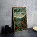 A vintage-style metal sign for Holly River State Park in West Virginia, featuring a scenic illustration of the river and mountains.