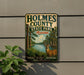 A vintage metal sign for Holmes County State Park in Mississippi, featuring a deer in a natural setting.