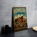 A vintage-style sign for Homolovi State Park in Arizona, featuring an illustration of a desert landscape with a large stone structure.