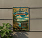 A vintage-style metal sign for Honey Creek State Park in Oklahoma, featuring a scenic landscape with a lake, mountains, and trees.