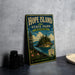 A vintage-style metal sign for Hope Island State Park in Washington, featuring a scenic landscape with a small island, pine trees, and a body of water.