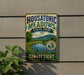 A vintage-style metal sign for Housatonic Meadows State Park in Connecticut, featuring a scenic landscape with a river and mountains.