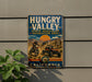 A vintage metal sign for the Hungry Valley State Vehicular Recreation Area in California, featuring an illustration of a person riding a dirt bike and a jeep.